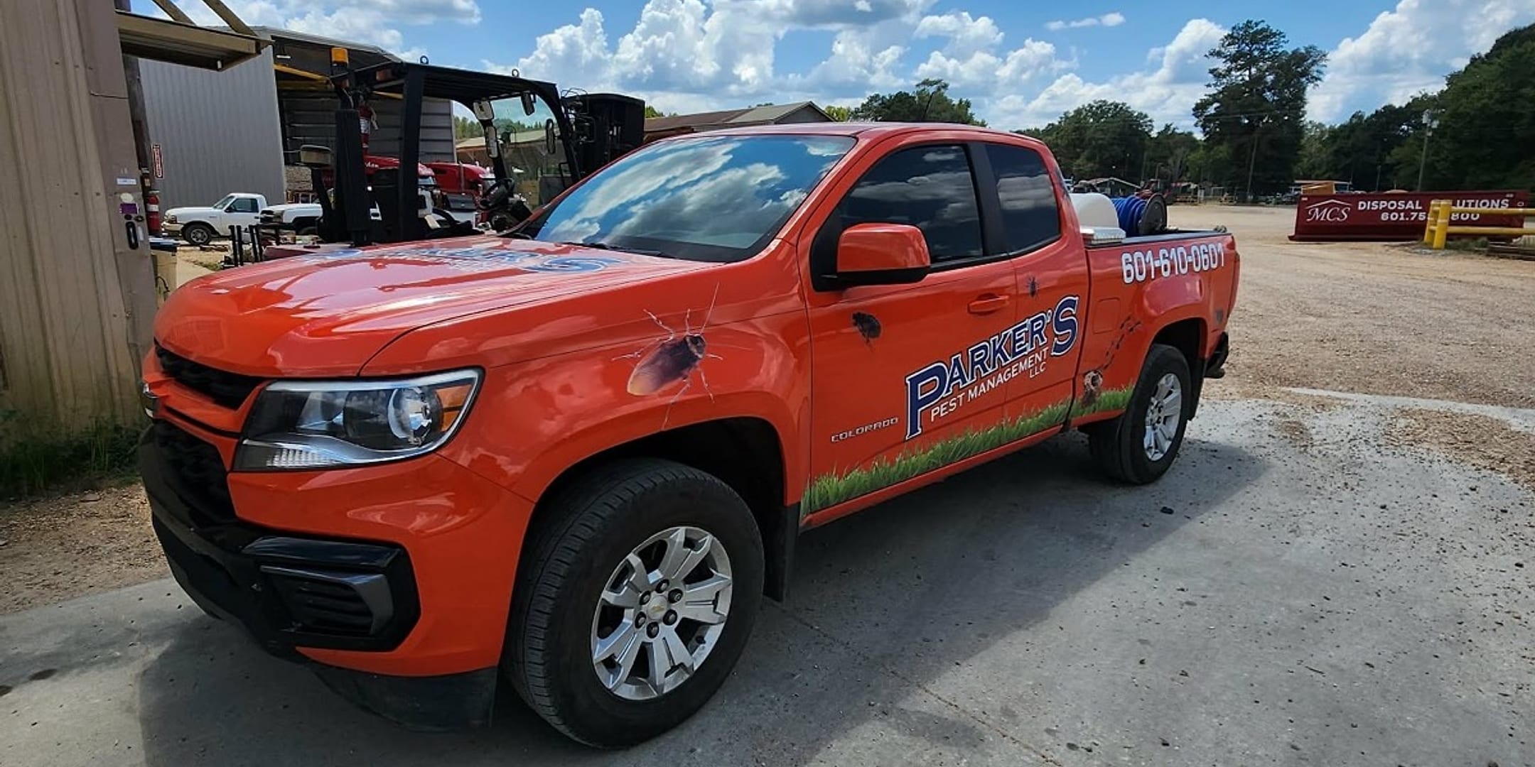 A Parker's Pest Management truck at a commercial property