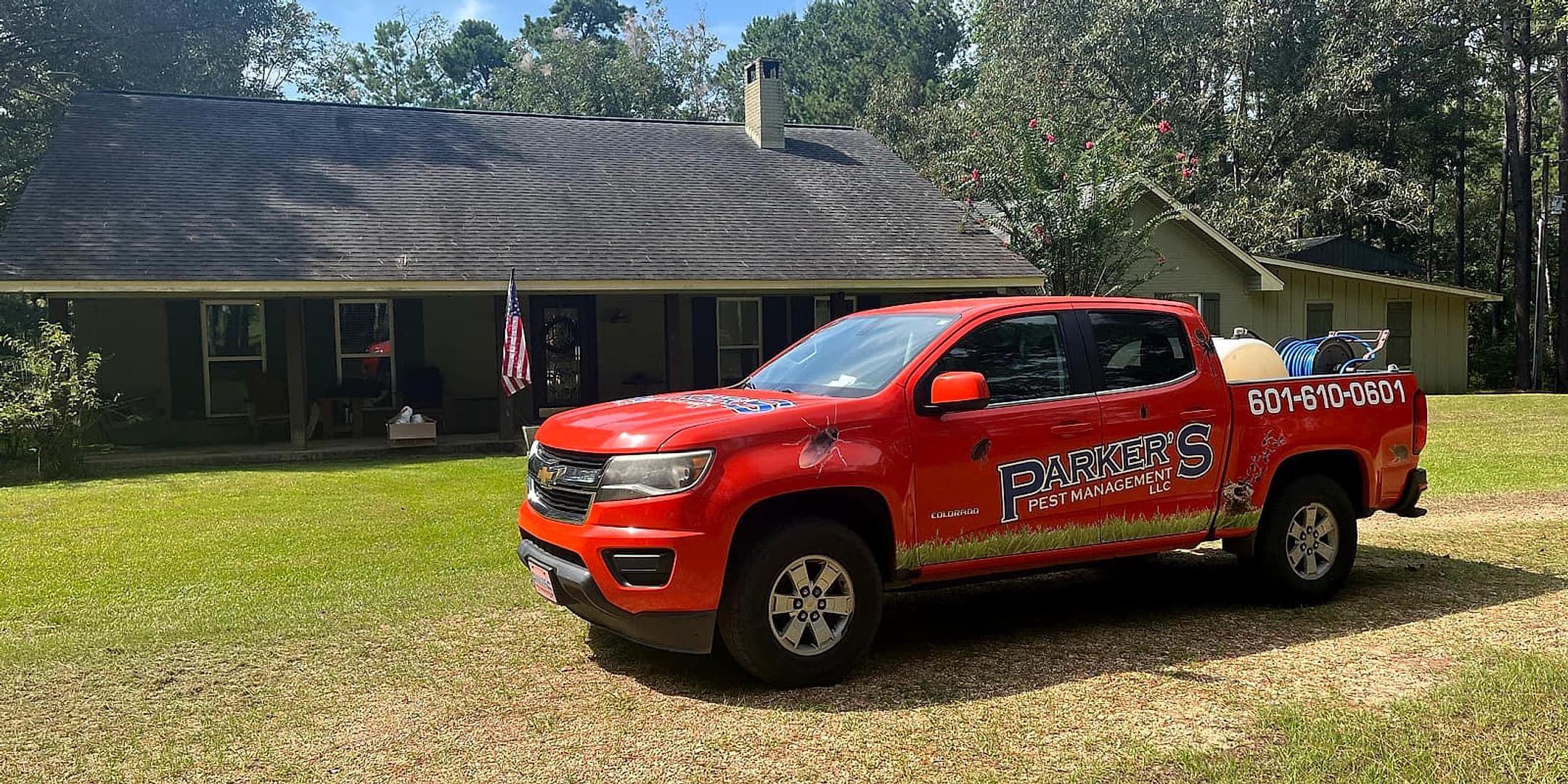 A Parker's Pest Management truck parked at a home in the Pine Belt